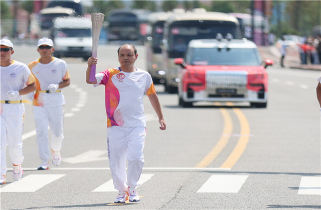 亞運火炬手韋曉青：參與“大蓮花”建設，傳遞火炬一生難忘